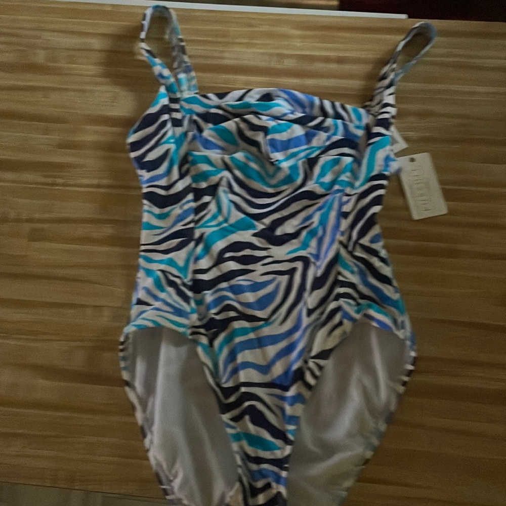 Brand new one piece bathing suit!! Material that moves with you